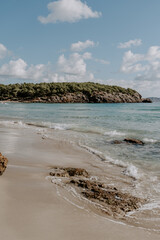 A tranquil scene of beautiful landscape in Ibiza overlooking turquoise waters and white sand beach.