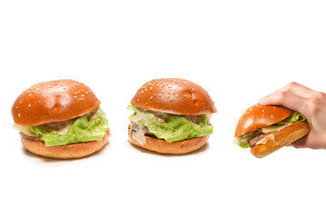 Hamburger in woman hands isolated on a white background.