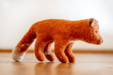 Diy souvenir. The fox is a cute bright beautiful toy of orange color
