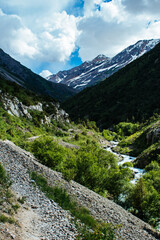 mountain gorge under sky with clouds