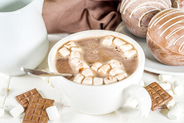 Homemade hot chocolate bomb with marshmallow and chocolates and nuts, Cooking making cocoa with...