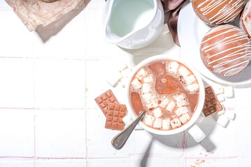 Homemade hot chocolate bomb with marshmallow and chocolates and nuts, Cooking making cocoa with...