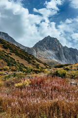 amazing mountain peaks under blue sky and clouds