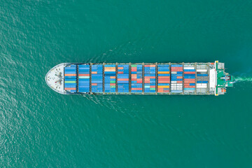 Aerial top view of cargo ship carrying container for import export goods  to customer,concept...