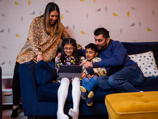 Parents and children using digital tablet