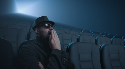A lone moviegoer yawns during a movie show