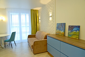 KALININGRAD, RUSSIA - JANUARY 09, 2022: Interior of the living room with wall lamps