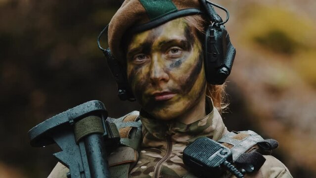  british armed military forces female soldier portrait looking to the camera. High quality 4k footage