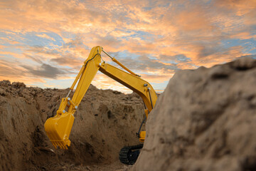 Selective focus ,Excavator with Bucket  are digging canalize the soil in the construction site on...