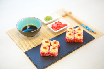 Maki roll with salmon, popular Japanese cuisine. Sushi roll with fish, cream cheese and vegetables
