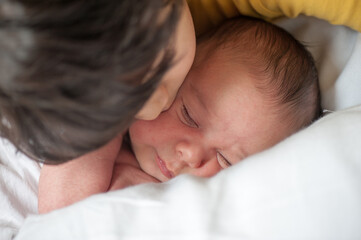 Newborn baby with his older brother, high quality