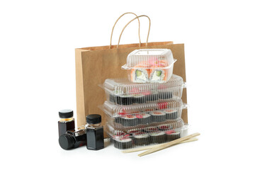 Concept of delivery food with sushi rolls isolated on white background © Atlas