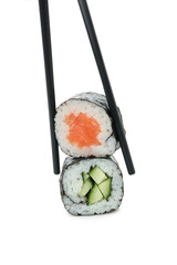 Chopsticks with maki isolated on white background © Atlas