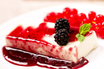 Panna Cotta with Fresh Red Berries on a Plate.
