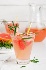 Fresh drink of juice, soda, grapefruit and rosemary. Healthy detox cocktail