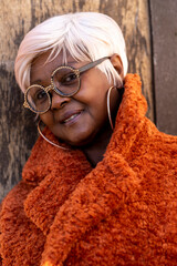 UK, South Yorkshire, Pensive woman with white hair and eyeglasses with crystals