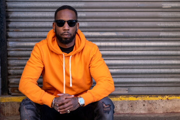 UK, South Yorkshire, Portrait of man in yellow shirt land sunglasses