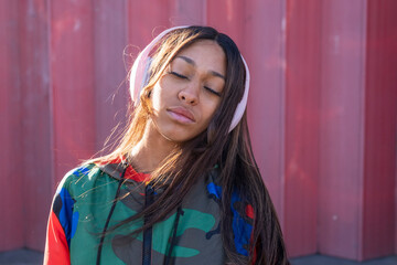 UK, South Yorkshire, Woman with headphones and eyes closed