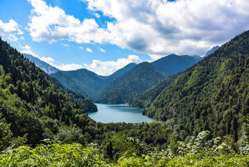 Naklejka na ściany i meble Beautiful mountain Lake Ritsa. Lake Ritsa in the Caucasus Mountains, in the north-western part of Abkhazia, Georgia