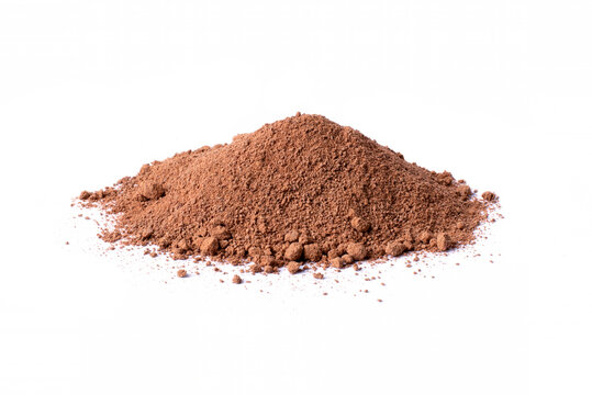 Pile of instant cocoa powder or cocoa grounds isolated on white background.