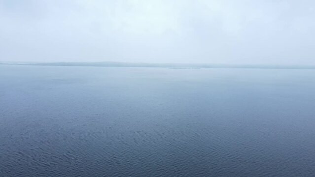 Flying over Lake Onega, in foggy rainy weather. Karelia.