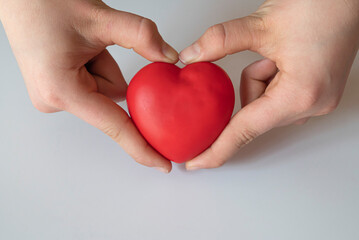 boy holding red heart. Organ donation and insurance concept. World heart health concept. World...