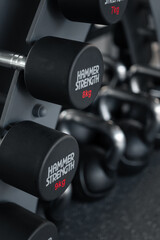 Dumbbells on the dumbbell rack in the gym.
