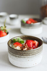 Strawberry, cream cheese and feta cream and crumble crust dessert. Homemade Sweet and salty cheesecake. Trifle. Selective focus