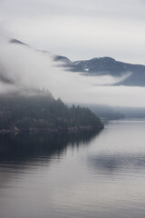 Scenic Canadian Nature View on the Pacific West Coast during cloudy and foggy winter day. Howe Sound, between Vancouver and Squamish, British Columbia, Canada.