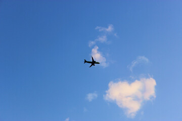 Jet plane in the sky with Condensation trace The only plane in the blue sky