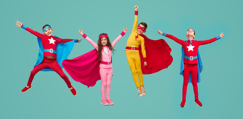 Little superheroes pretending to fly