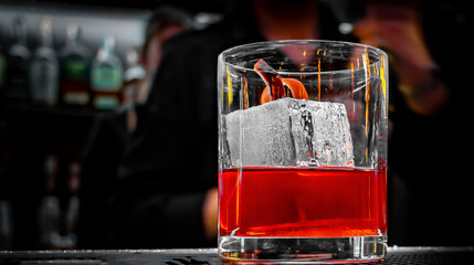 woman bartender hand making cocktail in glass on bar counter