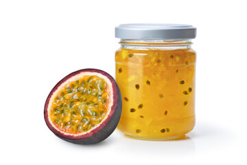 Passion fruit jam in glass jar with fresh passionfruit isolated on white background.