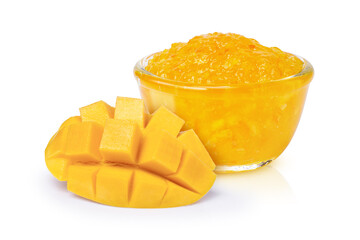 Mango jam in glass bowl and fresh mango fruit isolated on white background.