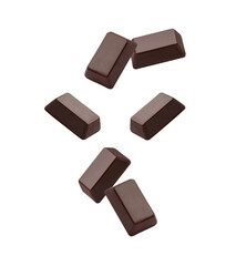 Chocolate pieces flying in the air isolated on white background.