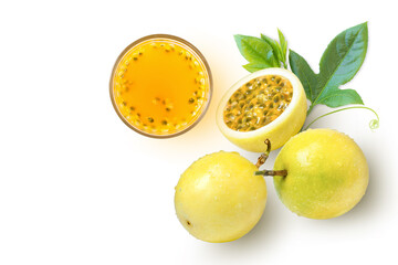 Glass of passionfruit juice (Maracuya} and yellow passion fruit with green leaf isolated on white background. Top view. Flat lay.
