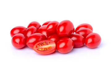 Pile of fresh red cherry tomatoes with half sliced isolated on white background.