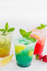 Summer lemonade group plastic cup ice cold white background