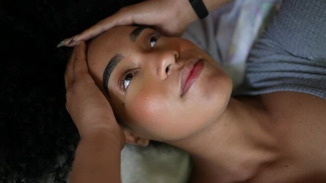 Pensive woman thinking about life lying in bed thoughtful person