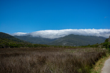 Fototapeta premium Mountain with blanket of clouds
