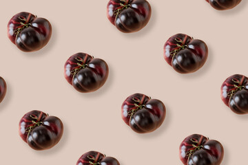 Purple tomato repeated in image as a pattern on warm color background