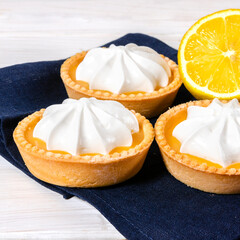 Cheesecake lemon tart cake or pie, with fresh lemon and mint. White background