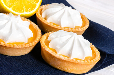 Cheesecake lemon tart cake or pie, with fresh lemon and mint. White background