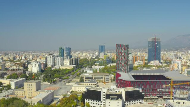 A drone view of the skyline of Tirana, Albania. Stadium, Mother Teresa Square, panorama, aerial view, skyscrapers - 4K Drone Video Footage