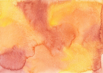 Watercolor orange and yellow background texture. Watercolour colorful backdrop. Stains on paper, hand painted.