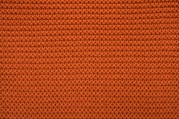 texture of orange fabric. knitting background