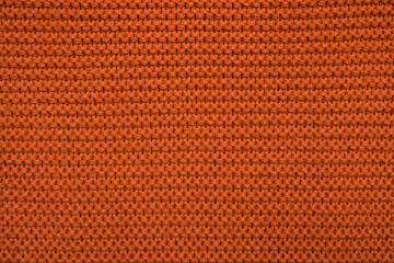texture of orange fabric. knitting background