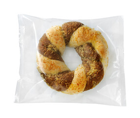 sweet party bread wrapped in plastic isolated on white