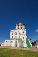 Fototapeta na wymiar Holy Trinity Cathedral is an Orthodox church in Pskov. Summer sunny day, blue sky. Vertical photo.