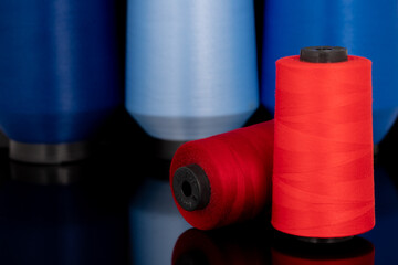 red sewing thread standing in an isolated environment